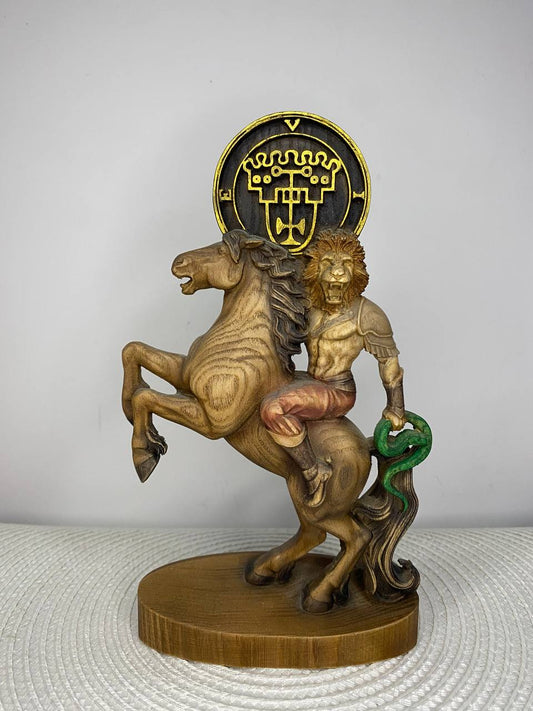 Hand-carved wooden King Vine statue from the Ars Goetia, depicting the lion-headed King riding a horse and holding a serpent, encircled by arcane sigils.