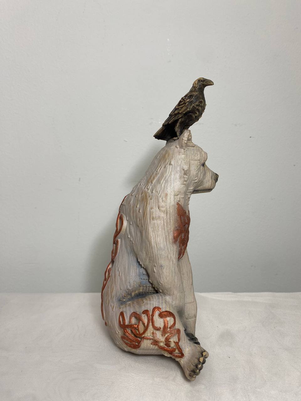 White Bear & Raven Statue: A Symbolic Carved Wooden Artwork