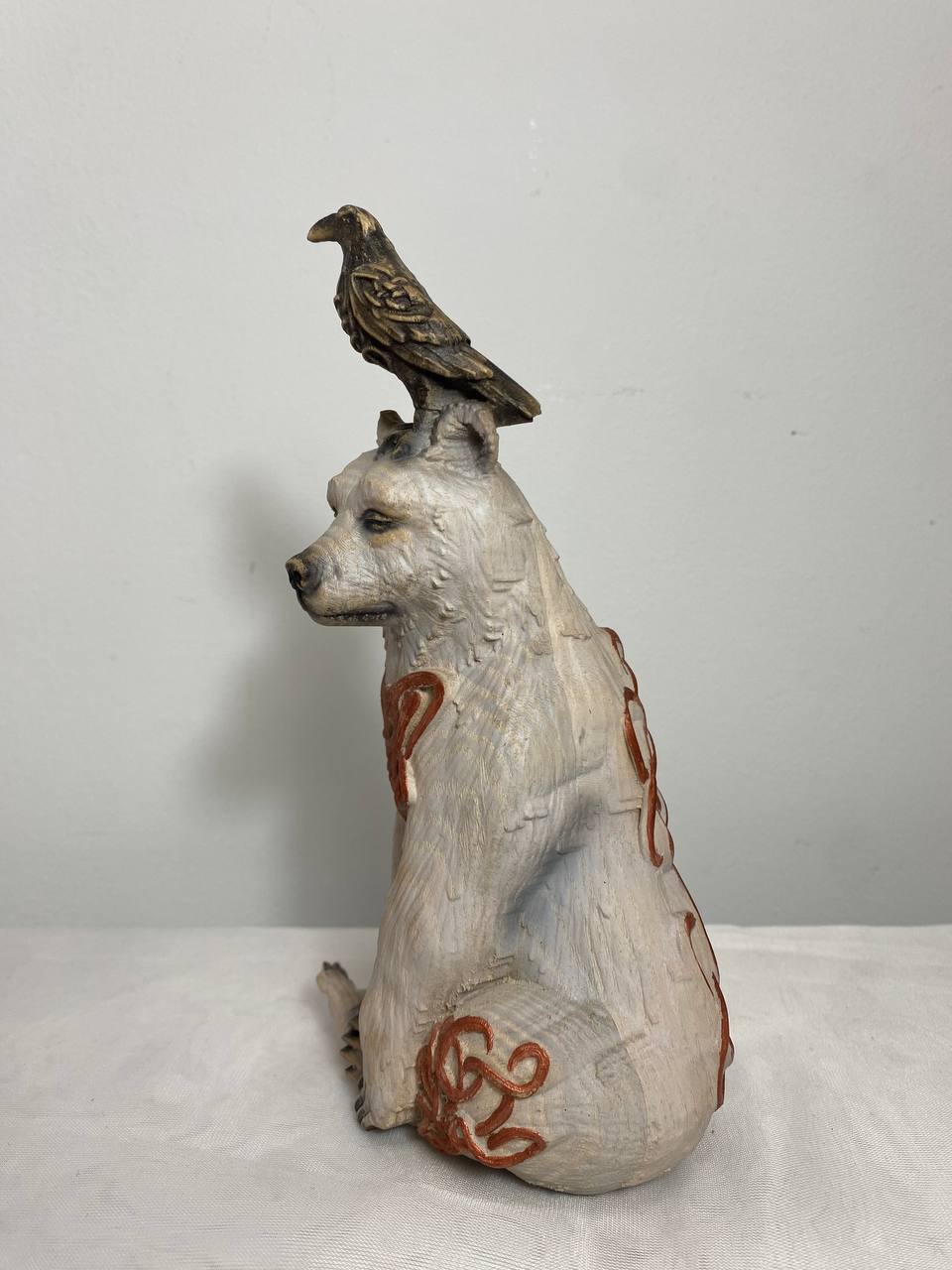 White Bear & Raven Statue: A Symbolic Carved Wooden Artwork