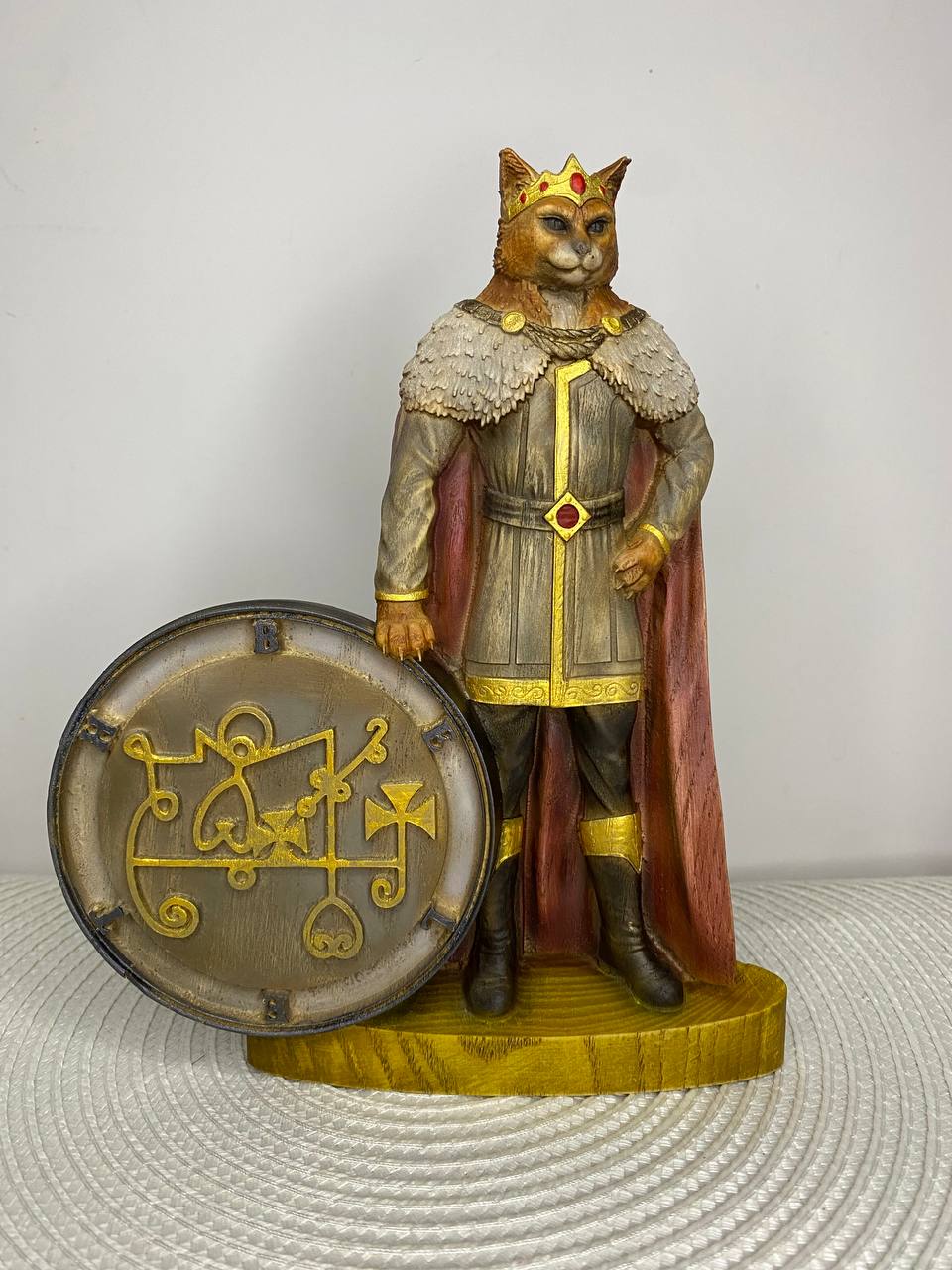 Hand-painted wooden statue of King Beleth depicted as a crowned anthropomorphic cat figure standing beside his Ars Goetia seal, inspired by occult demonology and gothic symbolic decor.
