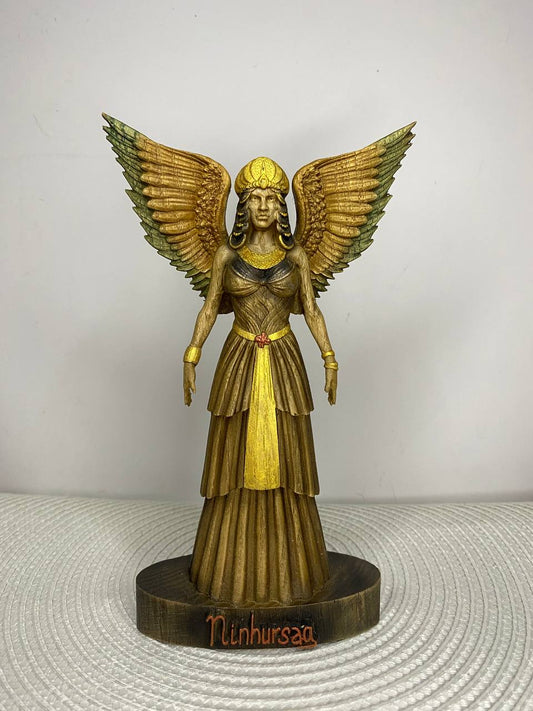 Hand-painted wooden statue of Ninhursag, Sumerian mother goddess with large wings and ceremonial dress, inspired by Mesopotamian mythology, sacred feminine symbolism, and spiritual altar decor.
