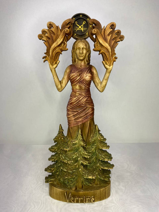 Handcrafted Verrine statue inspired by mythology and nature, featuring a graceful female figure emerging from a forest of pine trees. The sculpture is adorned with flowing robes, ornate leaf motifs, and a symbolic emblem above her head, finished in rich golden wood tones with intricate carved details.