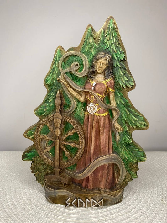 Decorative figurine of a woman with a harp and trees on a white background