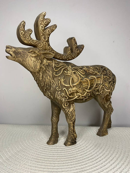 Hand-carved ash wood Celtic moose and caribou statue featuring a majestic antlered animal covered in intricate Celtic knotwork, swirling patterns, and traditional motifs.